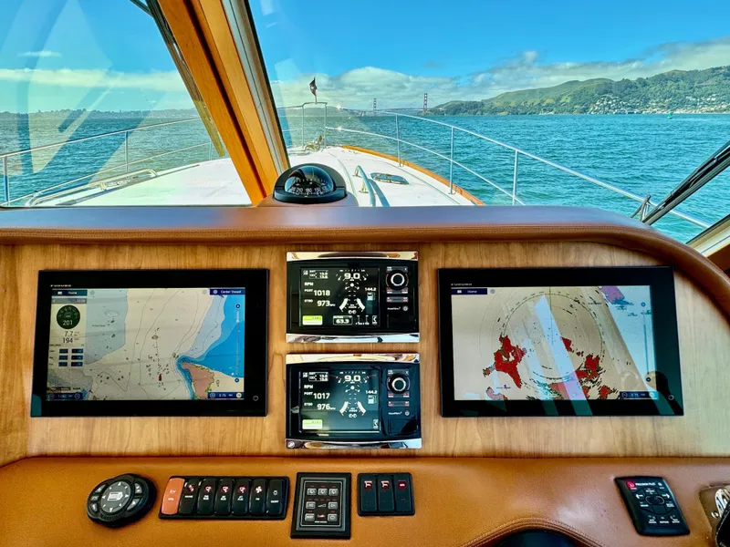 Slide: The Image of The cockpit of the 2016 Sabre 48 Salon Express features modern navigation systems and a vast sea view. - 33
