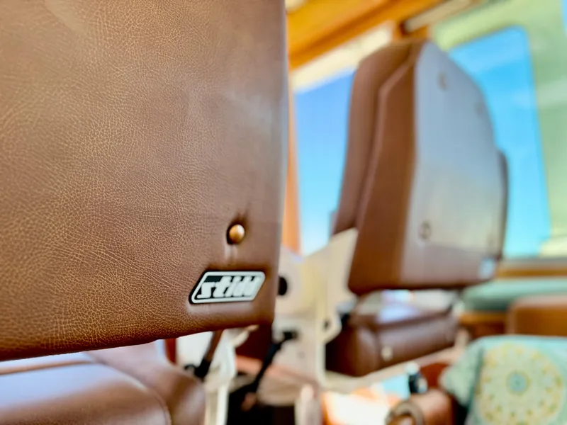 Slide: The Image of Close-up of brown leather seats in a 2016 Sabre 48 Salon Express. - 24