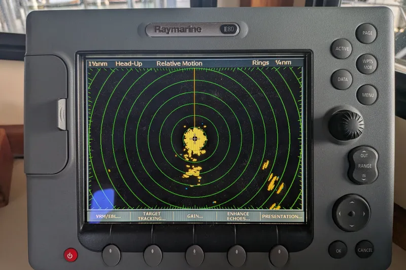 Slide: The Image of Raymarine E80 radar display on 1995 Nordic Tug 26 boat, showing navigation data. - 27