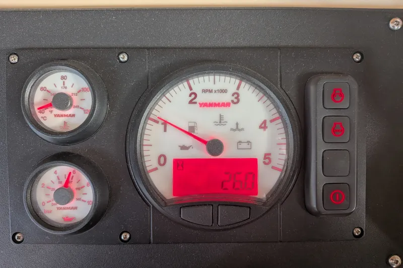 Slide: The Image of Instrument panel of a 1995 Nordic Tug 26 with Yanmar gauges and controls. - 25