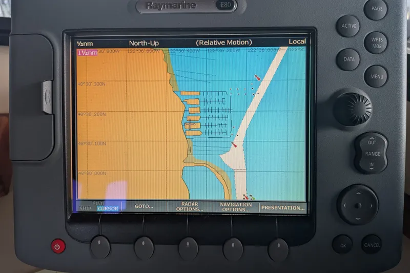 Slide: The Image of Navigation display on a 1995 Nordic Tug 26, showing coastal map and controls. - 26