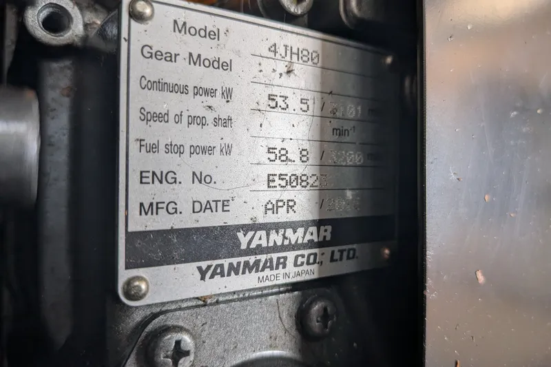 Slide: The Image of Yanmar engine plate on a 1995 Nordic Tug 26, displaying technical specifications. - 40