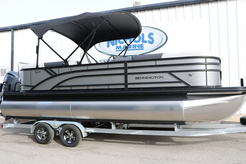 Slide: The Image of 2027 Bennington 22 S1SSR Tri Toon on a trailer with a black sunshade. - 3