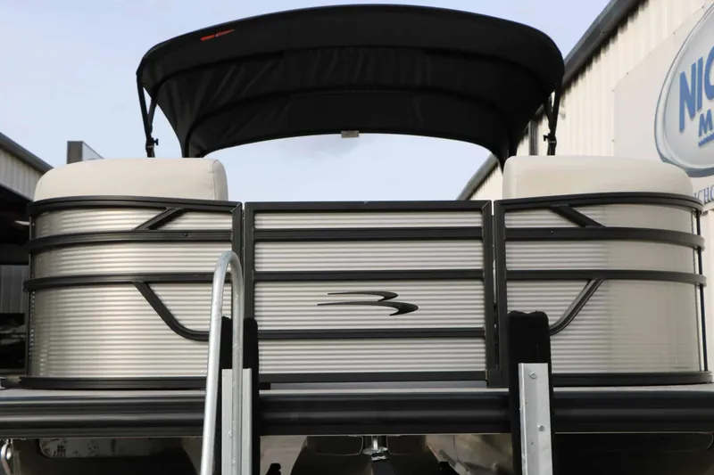 Slide: The Image of 2027 Bennington 22 S1SSR Tri Toon with sleek design and black sunshade. - 9