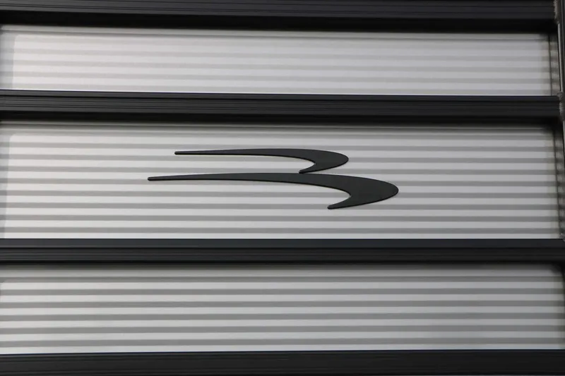 Slide: The Image of Close-up of the Bennington logo on a striped background. - 10