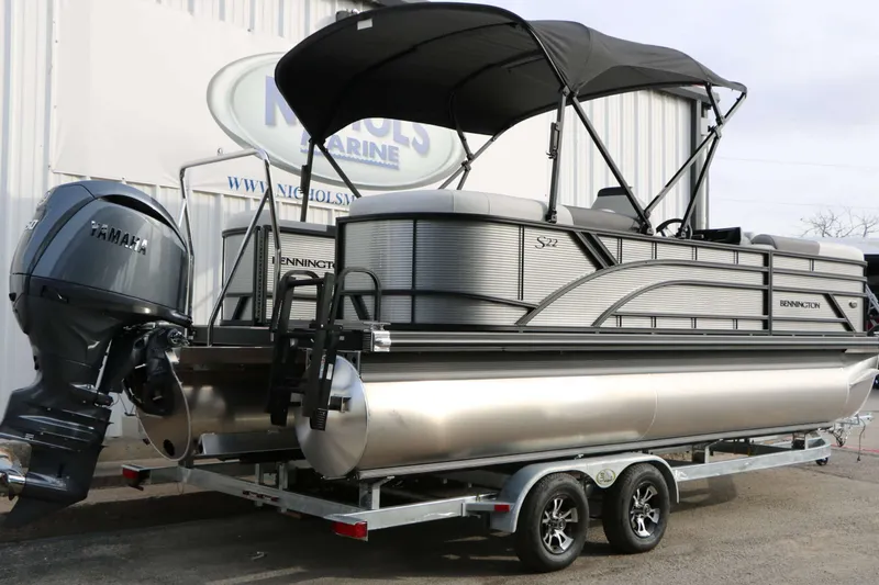 Slide: The Image of 2027 Bennington 22 S1SSR Tri Toon on a trailer with a black sunshade. - 14