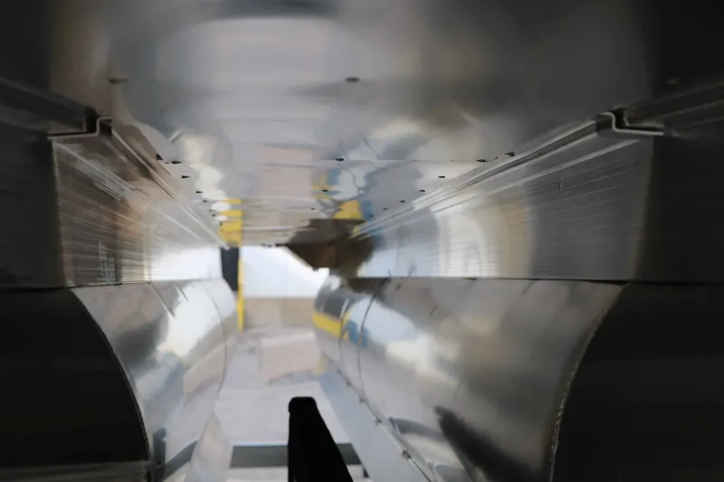 Slide: The Image of Underside of a 2027 Bennington 22 S1SSR Tri Toon with shiny aluminum hulls. - 12