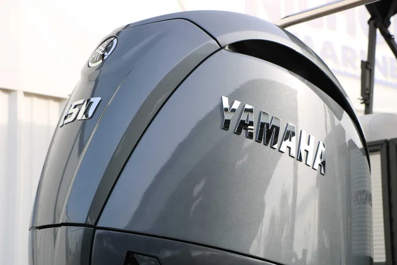 Slide: The Image of Close-up of a Yamaha 150 HP outboard motor on a boat. - 20
