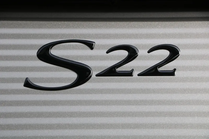 Slide: The Image of Black letters "S22" on a striped background. - 24