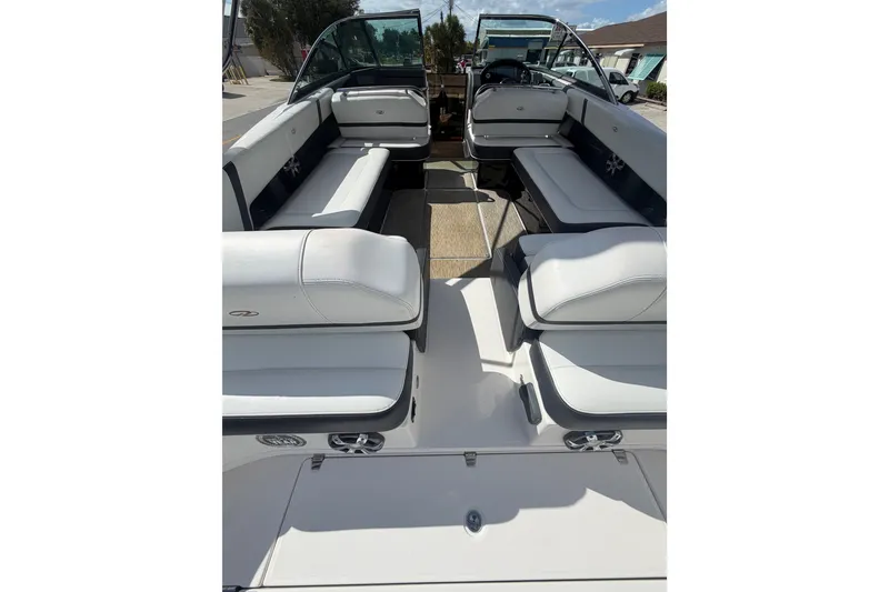 Slide: The Image of 2017 Regal 29 OBX boat interior with white seating and open cockpit. - 30