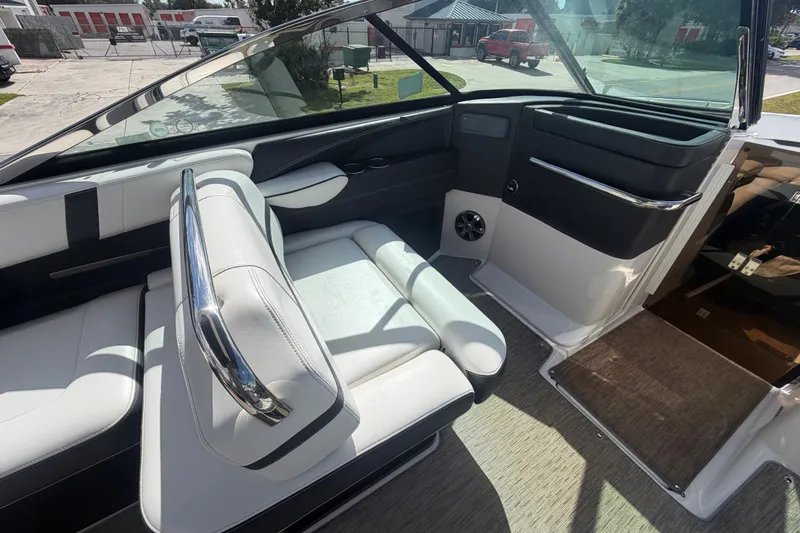 Slide: The Image of Interior of 2017 Regal 29 OBX boat with white seating and sleek design. - 21