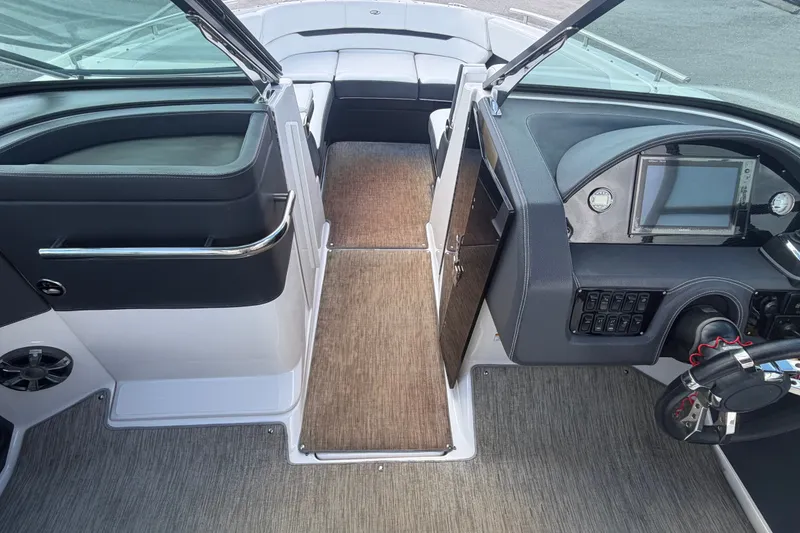 Slide: The Image of Interior view of a 2017 Regal 29 OBX boat cockpit with modern controls and seating. - 13