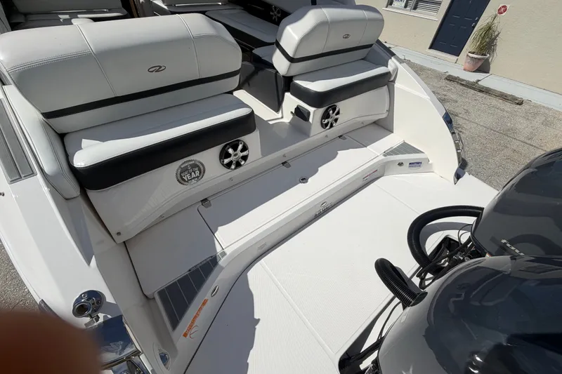 Slide: The Image of 2017 Regal 29 OBX boat interior with white seating and dual engines. - 31