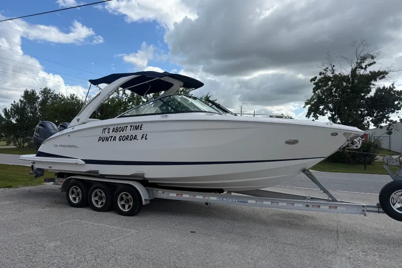 The Image of 2017 Regal 29 OBX boat on trailer, labeled "It's About Time, Punta Gorda, FL." - 0