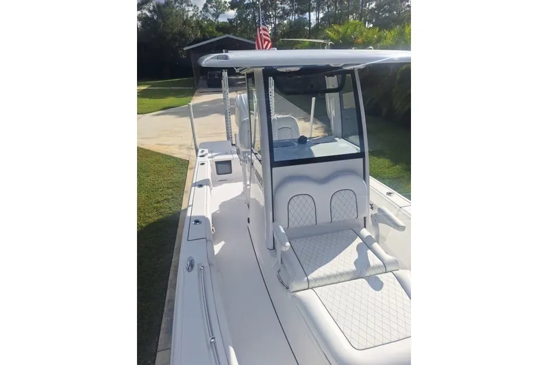 Slide: The Image of 2022 Sportsman Masters 247OE Bay Boat with sleek design and comfortable seating. - 9