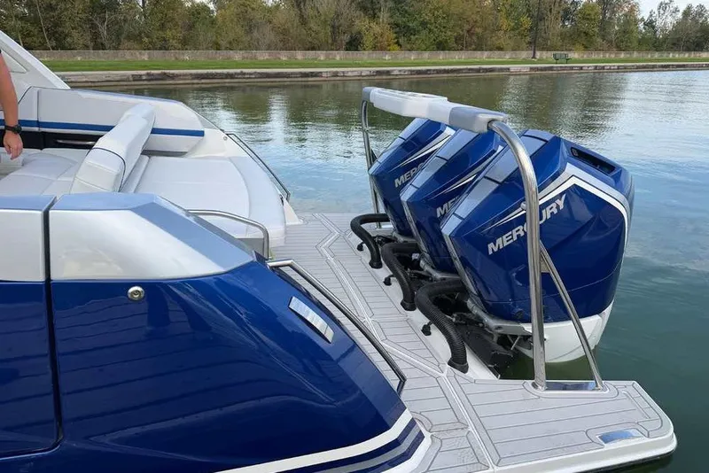Slide: The Image of 2027 Formula 360 Super Sport Crossover with Mercury engines on a calm waterway. - 5