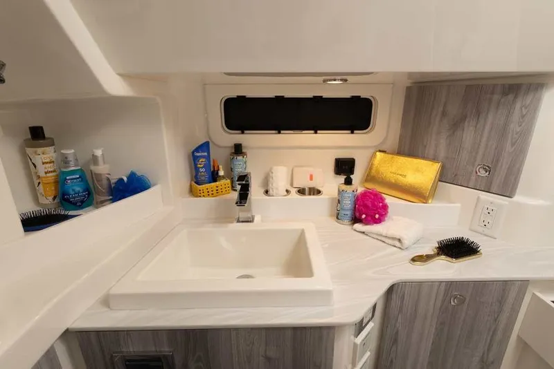 Slide: The Image of 2027 Formula 360 Super Sport Crossover bathroom with sink, toiletries, and modern design. - 46