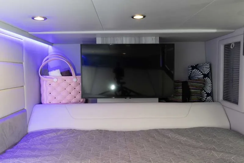 Slide: The Image of Interior of 2027 Formula 360 Super Sport Crossover with TV, bed, and ambient lighting. - 43