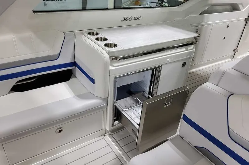 Slide: The Image of 2027 Formula 360 Super Sport Crossover interior with open drawer and seating area. - 19