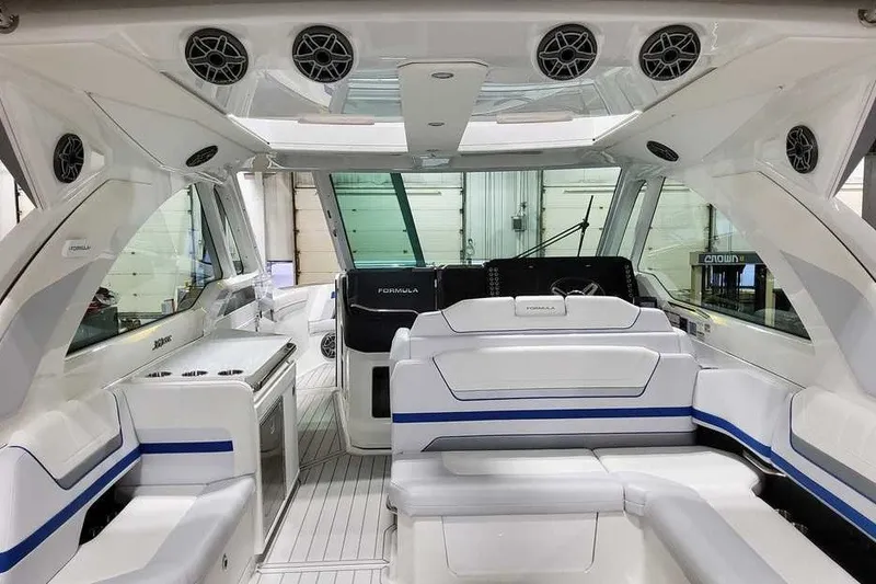 Slide: The Image of 2027 Formula 360 Super Sport Crossover interior with sleek white seating and modern design. - 17