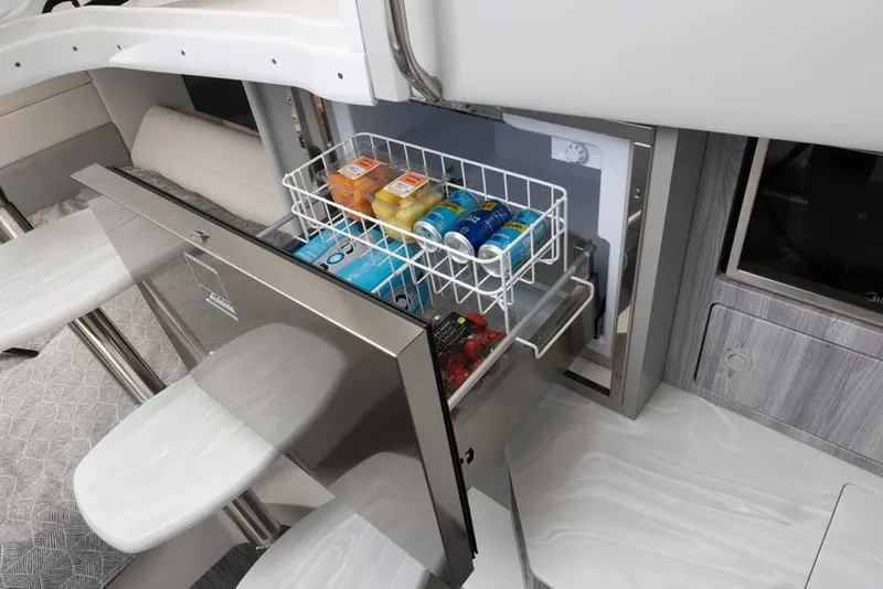 Slide: The Image of Interior of 2027 Formula 360 Super Sport Crossover with open fridge drawer. - 41