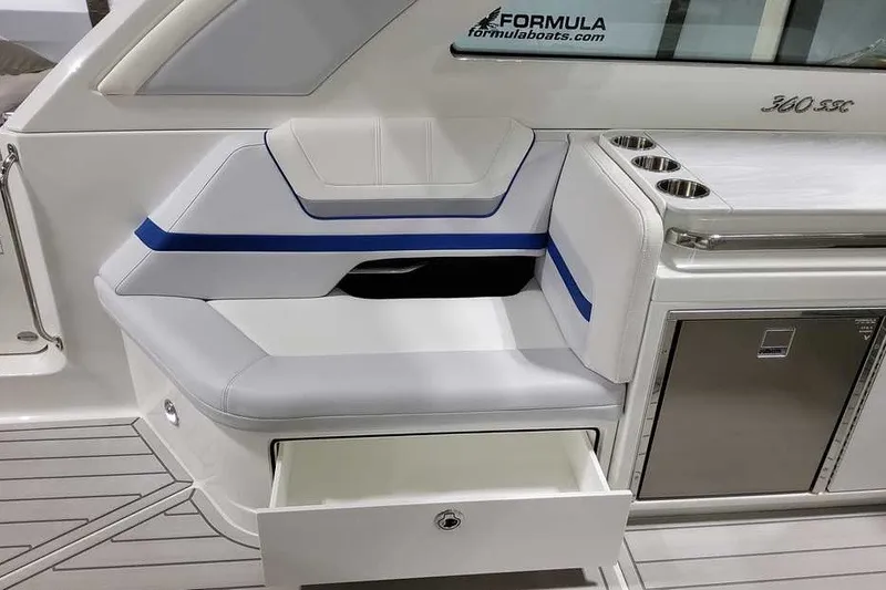 Slide: The Image of 2027 Formula 360 Super Sport Crossover boat interior with seating and storage drawer. - 18