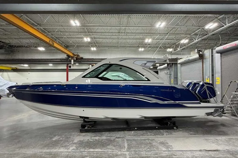 Slide: The Image of 2027 Formula 360 Super Sport Crossover boat in a warehouse setting. - 10
