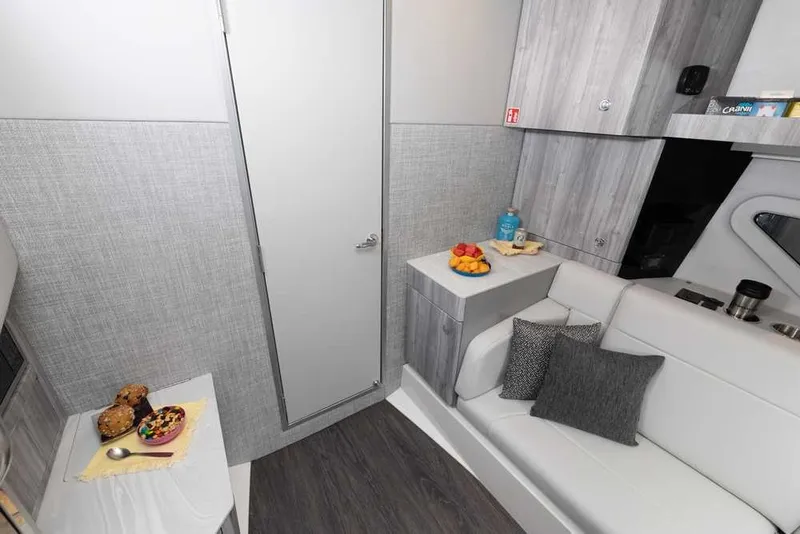 Slide: The Image of Interior of 2027 Formula 360 Super Sport Crossover with modern seating and snacks. - 35