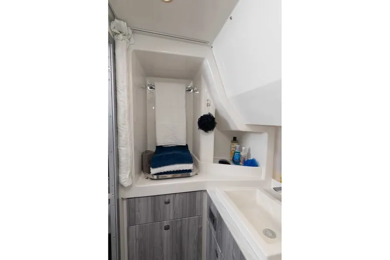 Slide: The Image of 2027 Formula 360 Super Sport Crossover bathroom with modern sink, storage, and toiletries. - 52