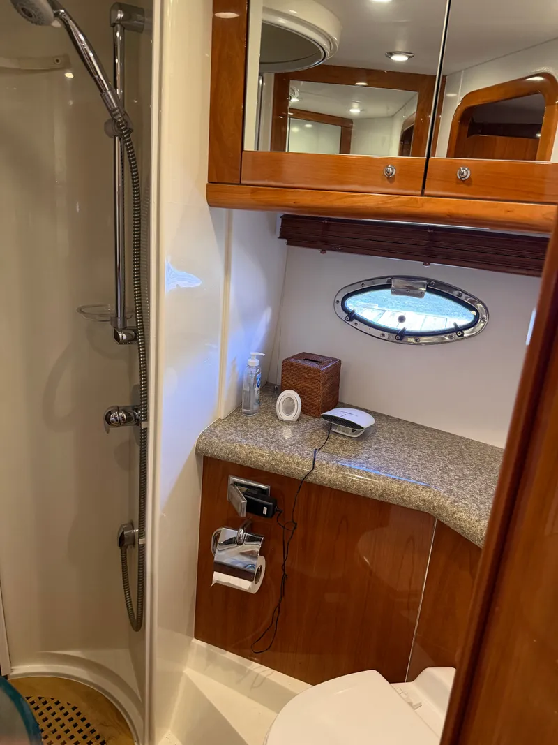 Slide: The Image of Bathroom with shower, sink, and mirror in a Sunseeker Portofino 46 yacht. - 13