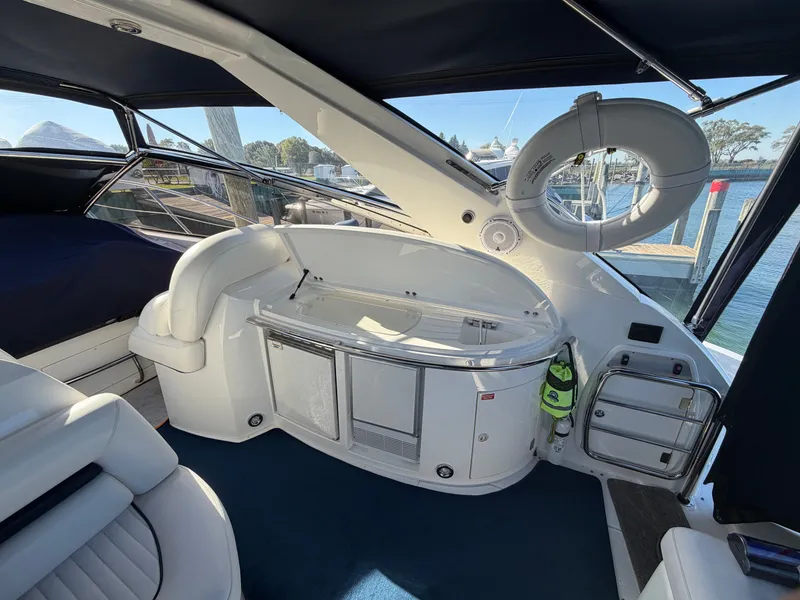 Slide: The Image of The image shows the cockpit of a 2006 Sunseeker Portofino 46 with sleek white seating. - 7