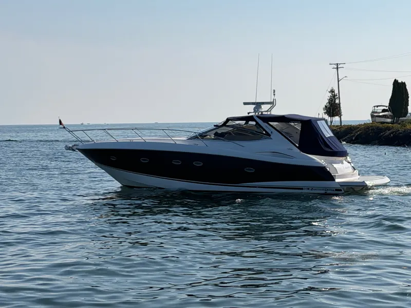 Slide: The Image of 2006 Sunseeker Portofino 46 on calm water. - 2