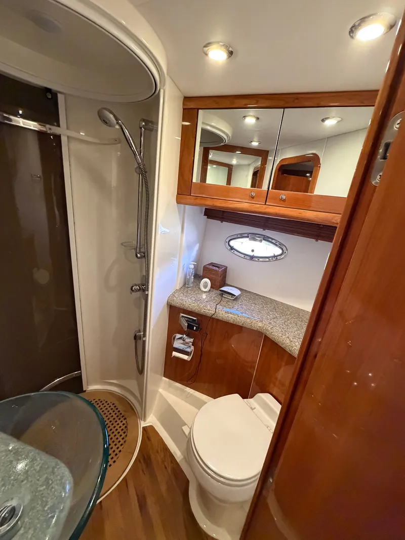 Slide: The Image of Luxurious bathroom with shower, toilet, and sink in a Sunseeker Portofino 46 yacht. - 15