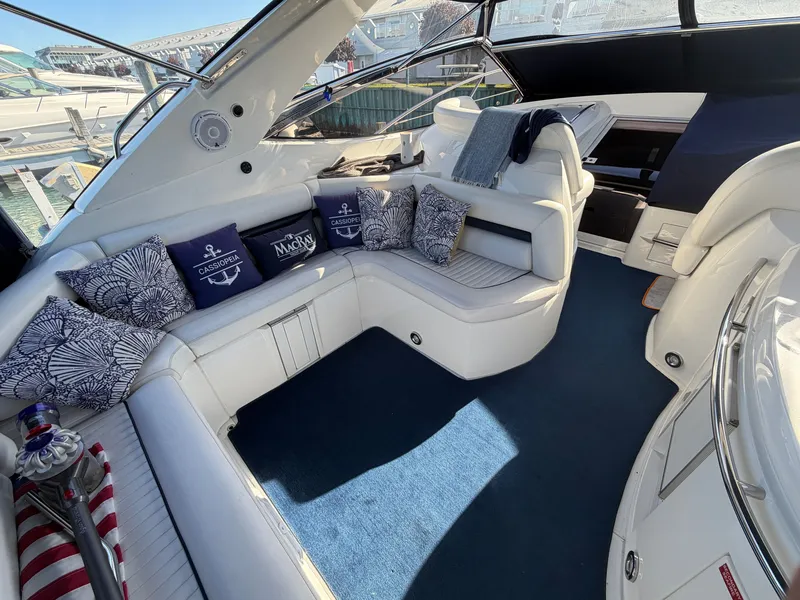 Slide: The Image of The image shows the luxurious cockpit of a Sunseeker Portofino 46 with elegant white seating. - 8
