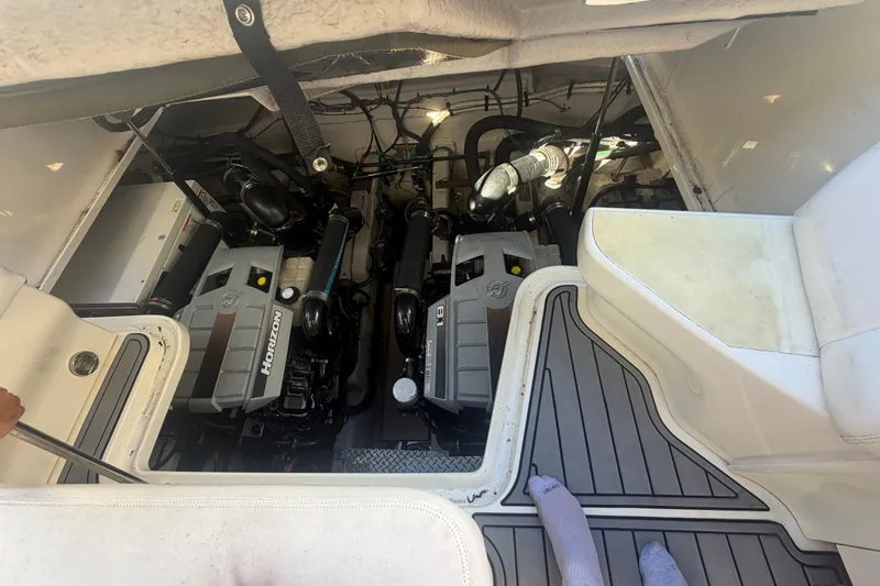 Slide: The Image of Engine compartment of a 2010 Sea Ray 390 Sundancer boat, showcasing twin Horizon engines. - 3