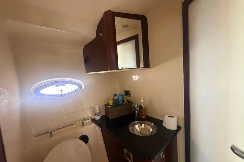 Slide: The Image of Bathroom interior of 2010 Sea Ray 390 Sundancer yacht with sink and storage. - 17