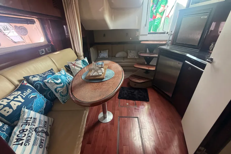 Slide: The Image of Luxurious interior of 2010 Sea Ray 390 Sundancer yacht with elegant seating and decor. - 11