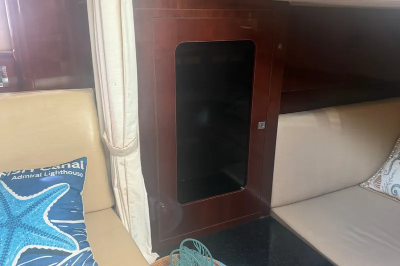 Slide: The Image of Interior of 2010 Sea Ray 390 Sundancer with seating and decorative pillows. - 9