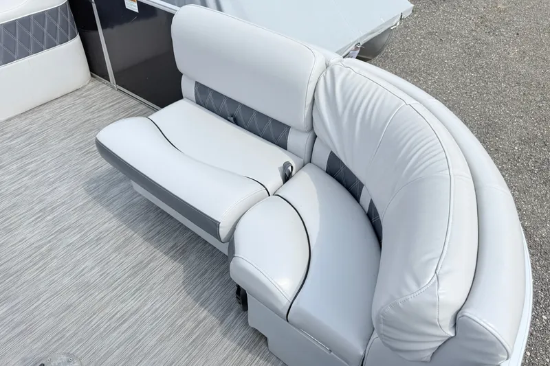 Slide: The Image of Luxurious seating on 2013 Sylvan Mirage 820 Cruise pontoon boat, featuring elegant white upholstery. - 4