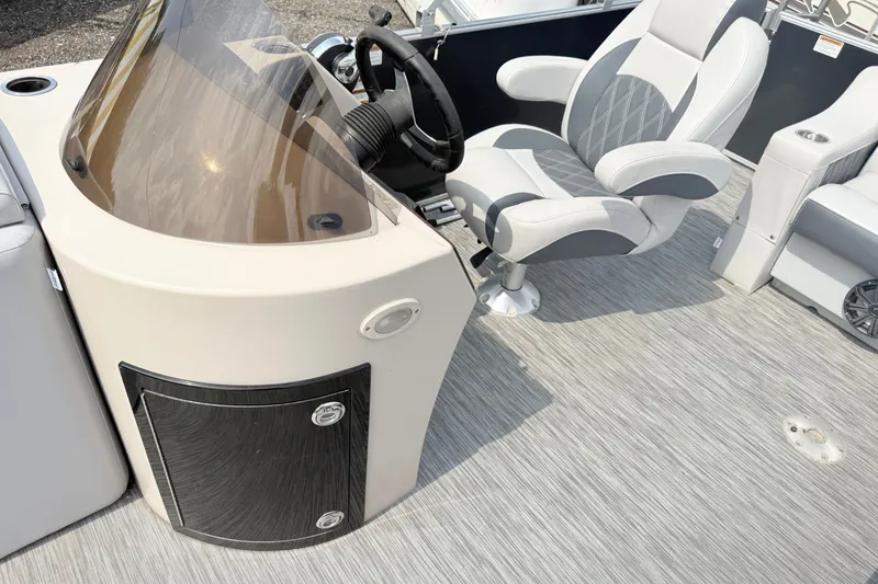 Slide: The Image of Captain's chair and console on 2013 Sylvan Mirage 820 Cruise boat interior. - 7
