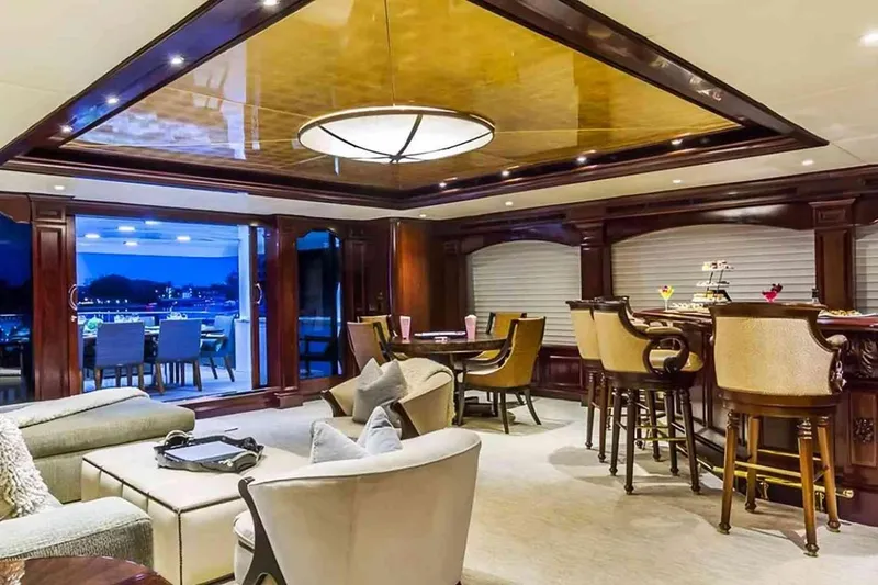 Slide: The Image of Luxurious interior of 2003 Trinity Yachts motoryacht with elegant seating and dining area. - 1
