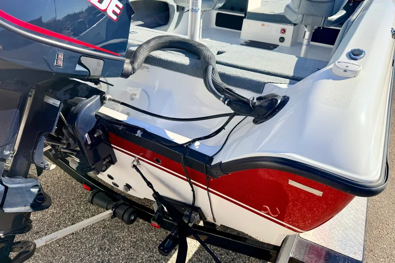 Slide: The Image of Rear view of a 2007 Stratos 375 XF boat with an outboard motor. - 21