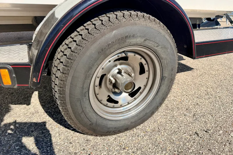 Slide: The Image of Trailer wheel of a 2007 Stratos 375 XF on asphalt surface. - 85
