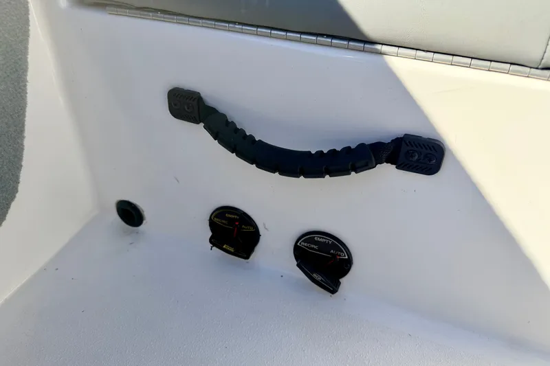 Slide: The Image of Control panel of a 2007 Stratos 375 XF boat with handle and gauges. - 34