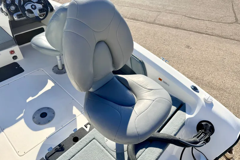 Slide: The Image of 2007 Stratos 375 XF boat interior with gray cushioned seats and steering console. - 23