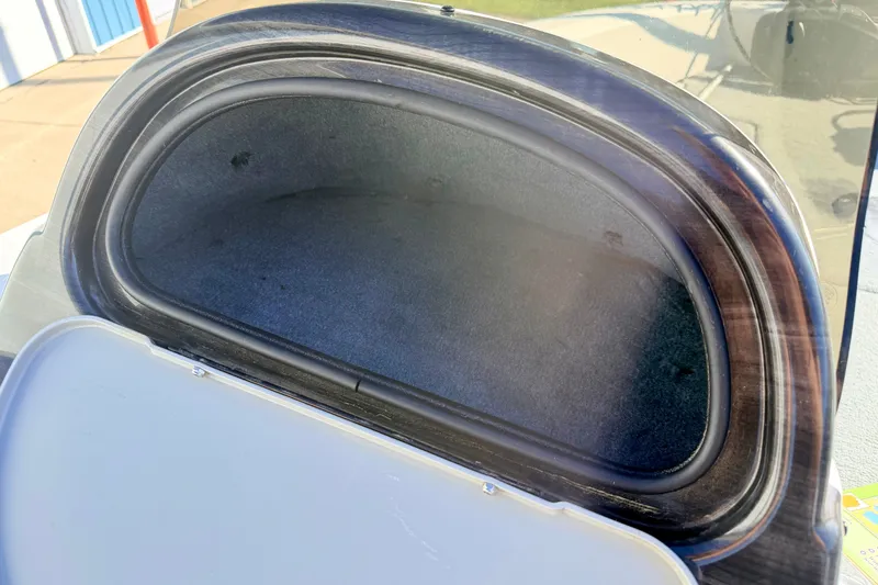 Slide: The Image of Open storage compartment in a 2007 Stratos 375 XF boat, showing interior space. - 53