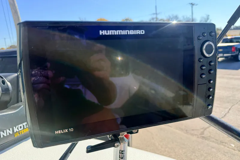 Slide: The Image of Humminbird Helix 10 fish finder on a 2007 Stratos 375 XF boat. - 71