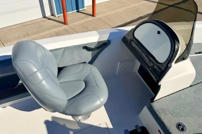 Slide: The Image of 2007 Stratos 375 XF boat interior with gray seat and windshield. - 49