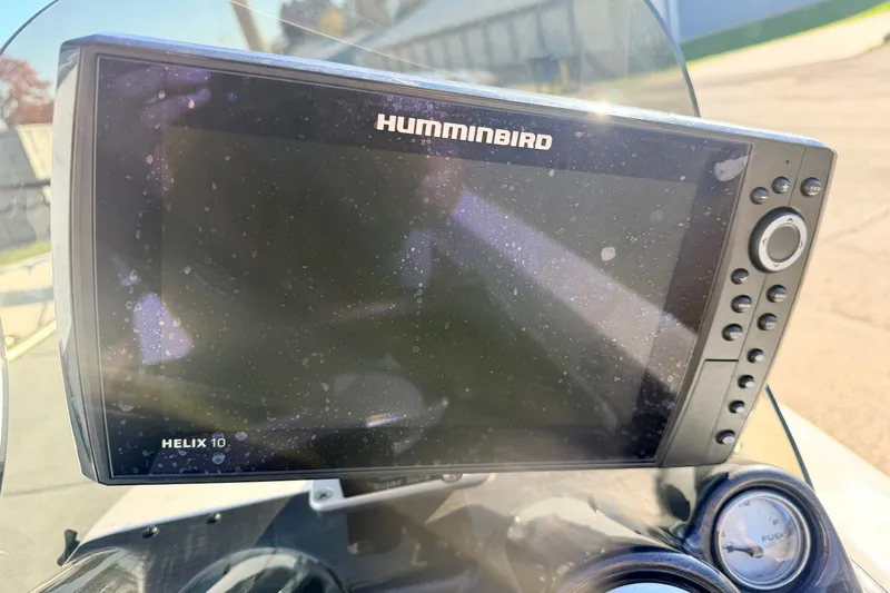 Slide: The Image of Humminbird Helix 10 fishfinder on a 2007 Stratos 375 XF boat dashboard. - 46