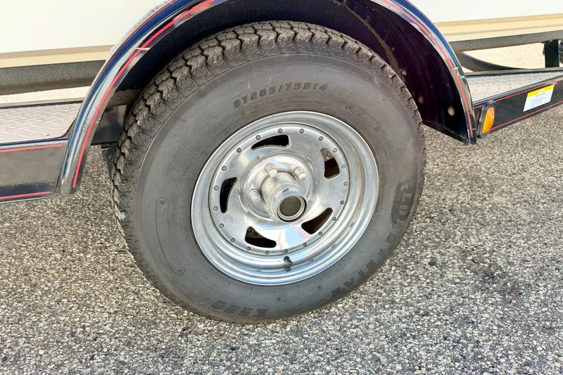 Slide: The Image of Trailer wheel of a 2007 Stratos 375 XF on asphalt surface. - 86